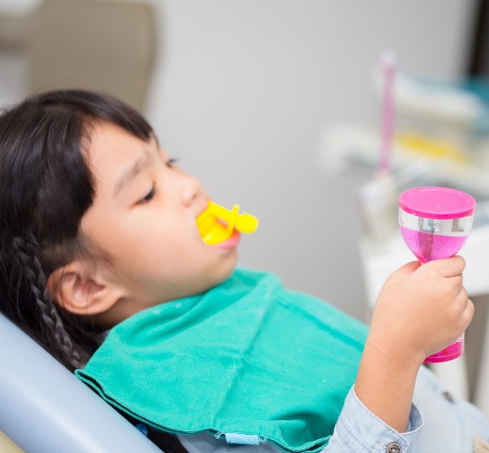 Child receiving fluoride treatment