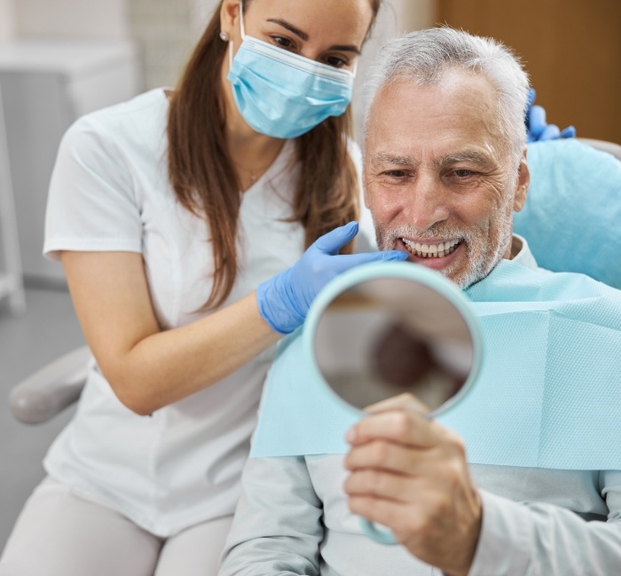 Smiling man enjoying the benefits of dental implants