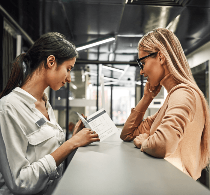 women discussing her membership plan options