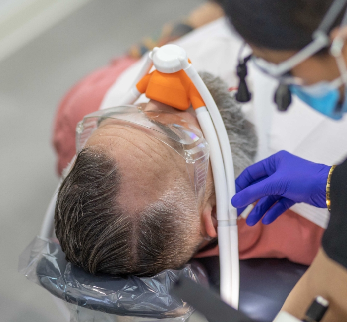 Man receiving emergency dental treatment