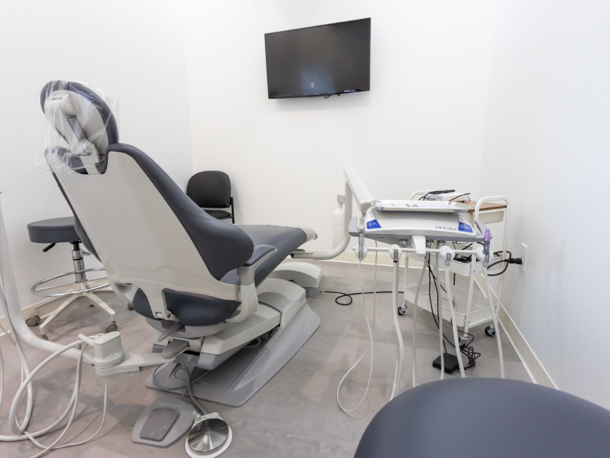 Back view of dental chair facing monitor