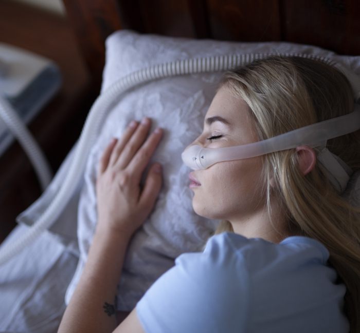 Woman sleeping soundly thanks to sleep apnea treatment