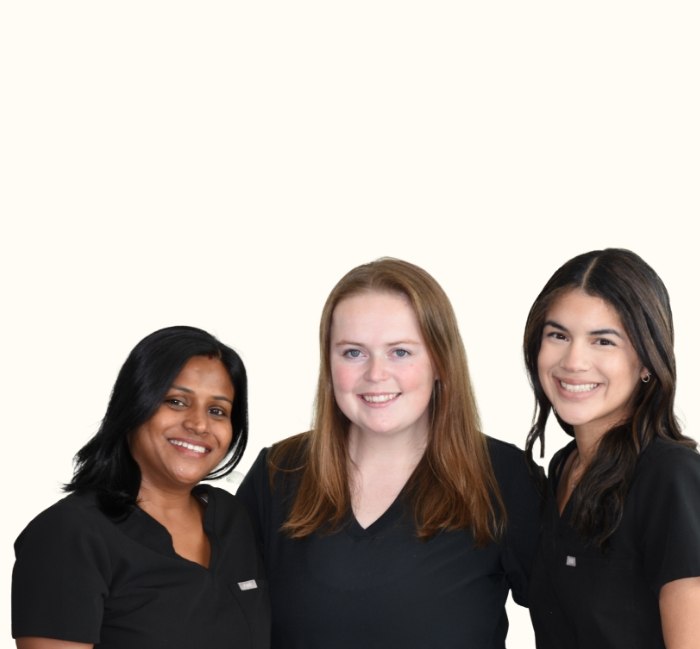 Oak Point dental team members standing and smiling