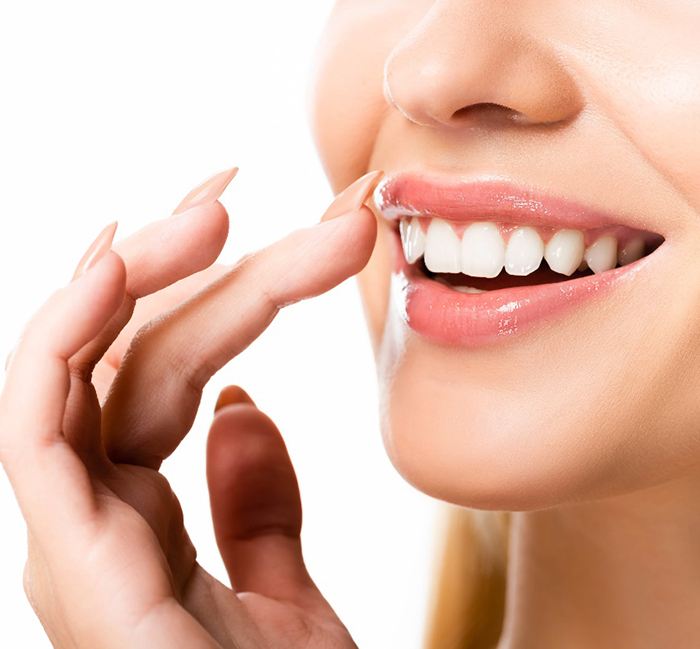 A closeup of a woman’s beautiful smile