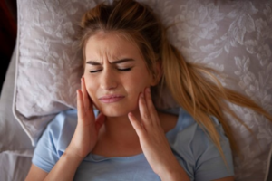 a patient experiencing tooth pain during the night